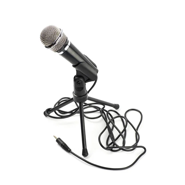Microfone preto em um rack isolado — Fotografia de Stock