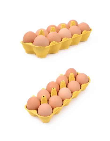 Žluté vejce krabičce izolované — Stock fotografie