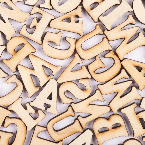 Surface covered with wooden letters