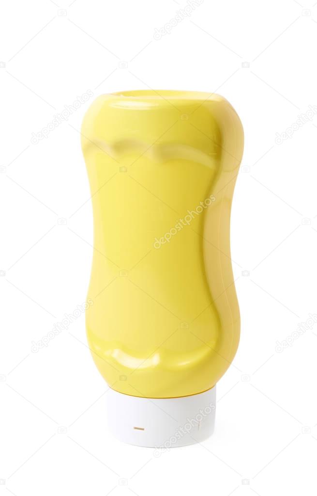 Yellow bottle of mustard isolated