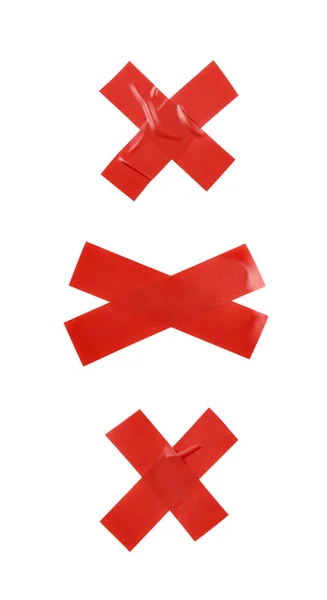 Kruis gemaakt van isolerend tape geïsoleerd — Stockfoto