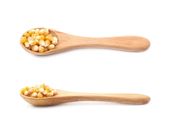 Wooden spoon filled with corn — Stock Photo, Image