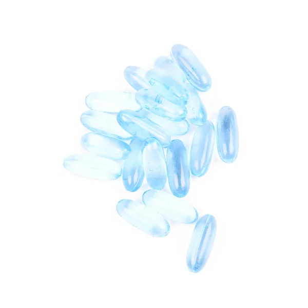 Kupie softgel niebieskie pigułki na białym tle — Zdjęcie stockowe