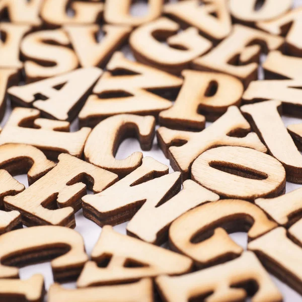 Oberfläche mit Holzbuchstaben bedeckt — Stockfoto