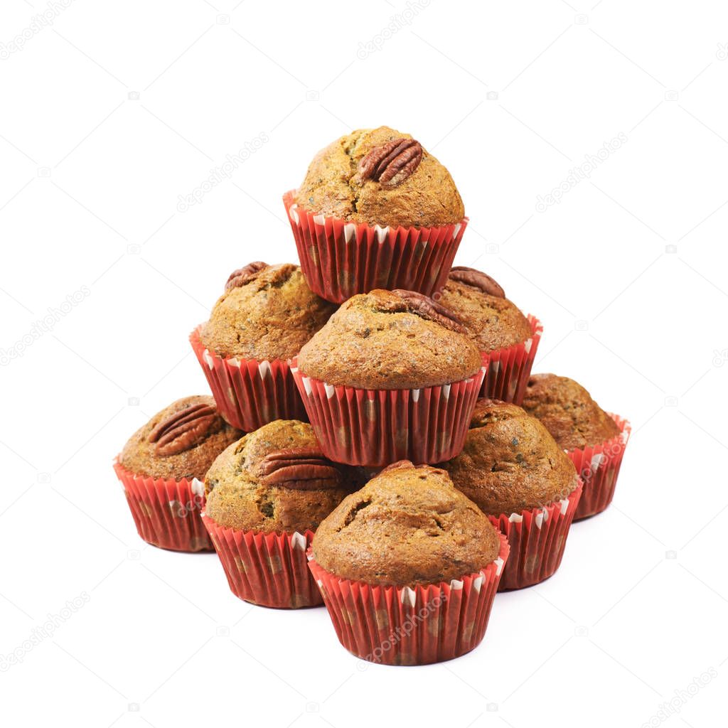 Pile of pecan nut cupcakes isolated