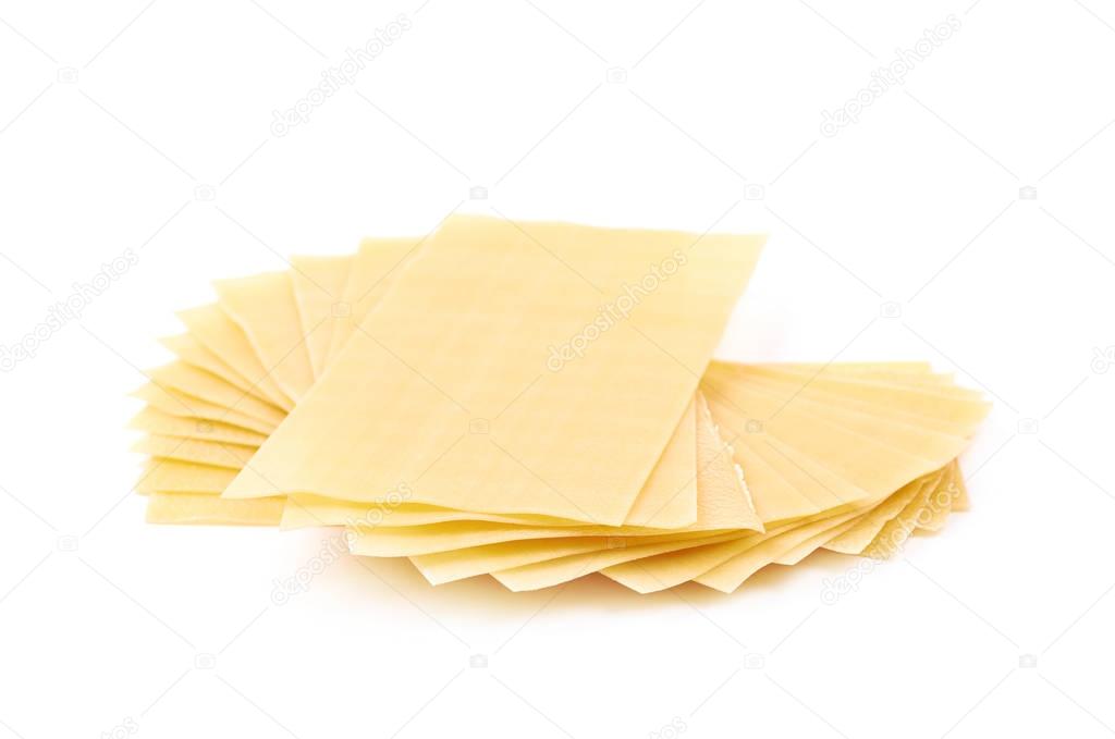 Pile of dried lasagna sheets isolated