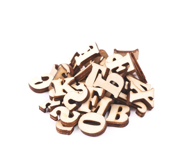 Haufen aus Holz geschnitzte Buchstaben isoliert — Stockfoto