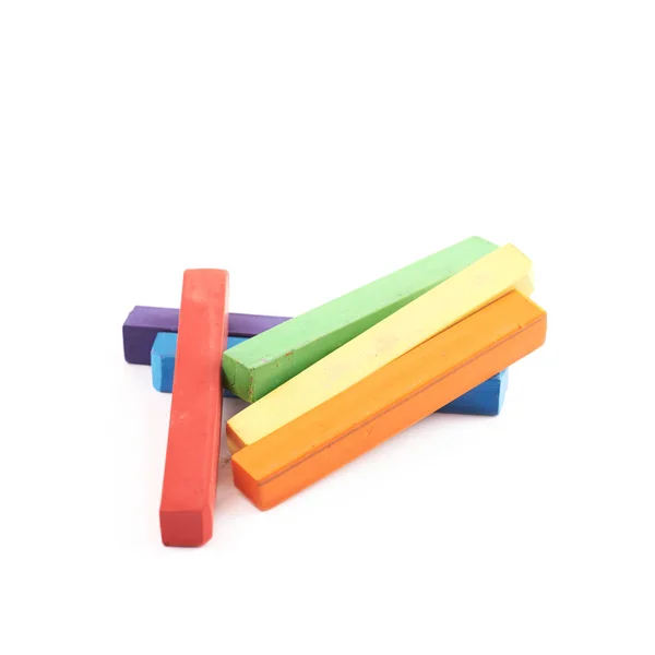 Pile of rainbow colored chalks isolated — Stock Photo, Image