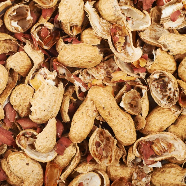 Surface coated with peanut shells — Stock Photo, Image