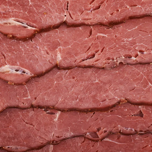 Många skivor av en skinka kött — Stockfoto