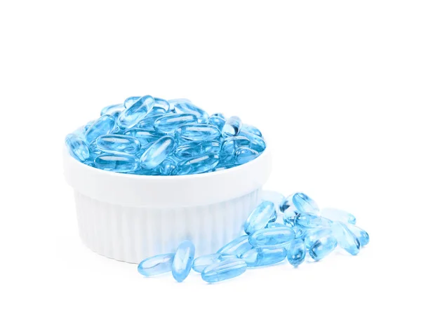 Miska z pigułki niebieski softgel — Zdjęcie stockowe