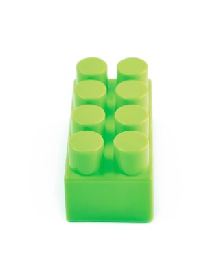 İzole tek oyuncak inşaat bloğu