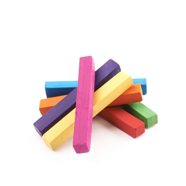 Pile of rainbow colored chalks isolated — Stock Photo, Image