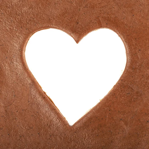 Forma de coração cortado em uma massa de biscoito — Fotografia de Stock