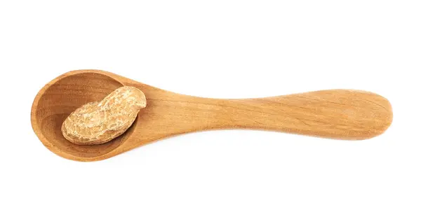 Einzelne Erdnüsse in einem Löffel — Stockfoto