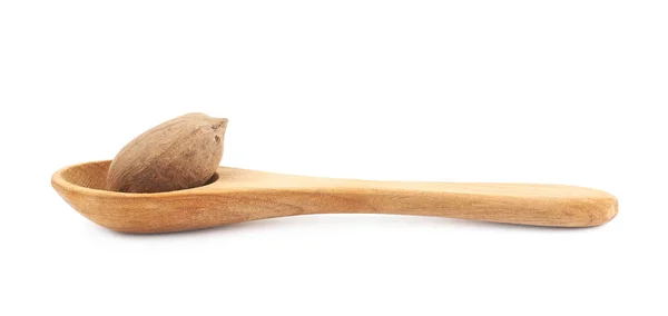 Drewnianą łyżką i pecan nut kompozycji — Zdjęcie stockowe