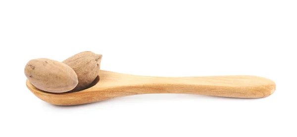 Drewnianą łyżką i pecan nut kompozycji — Zdjęcie stockowe