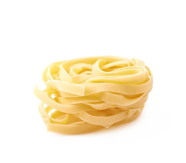 Uncooked fettuccine pasta isolated — Stock Photo, Image