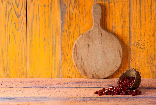 Cutting Board on wooden orange purple background