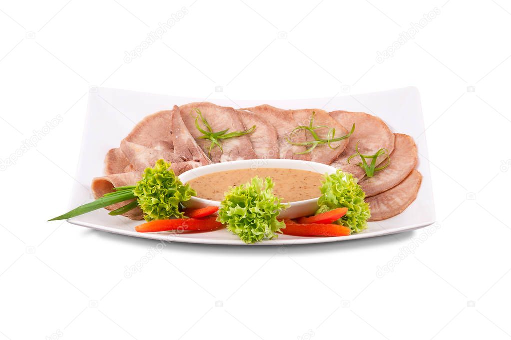 A plate with slices of sausage and meat delicacies