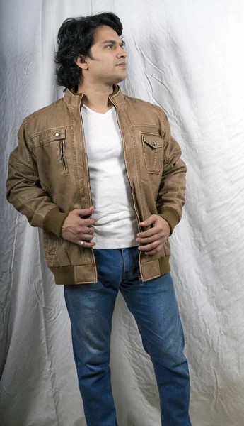 young indian male model wearing khaki jacket