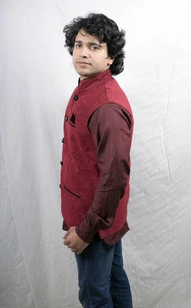 young indian male model in red half jacket