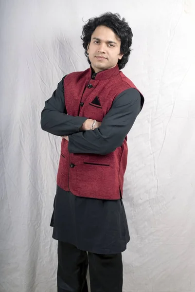 indian male model in black kurta and red half jacket