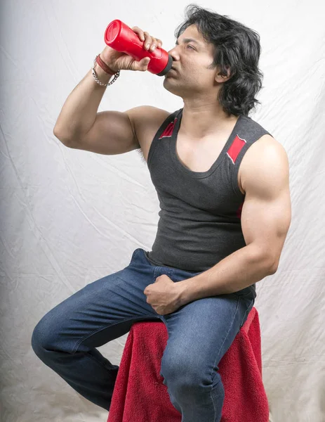 indian male model drinking protein