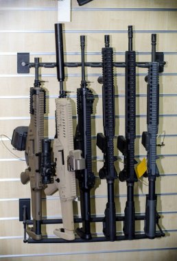 Gun wall rack with rifles clipart