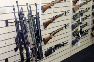 Gun wall rack with rifles clipart