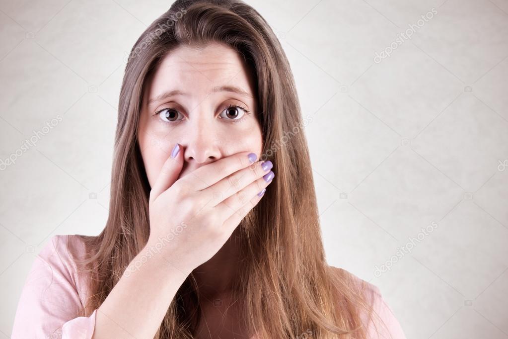 Concerned Woman Covering Mouth