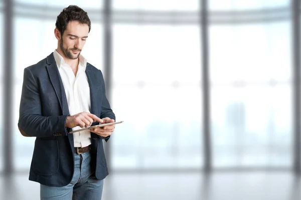 Casual Businessman Looking at a Tablet — Stock Photo, Image