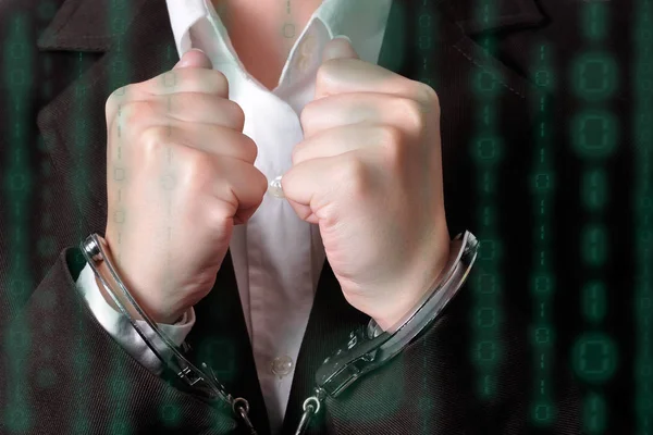 Closeup of an handcuffed businessperson in a dark suit — Stock Photo, Image
