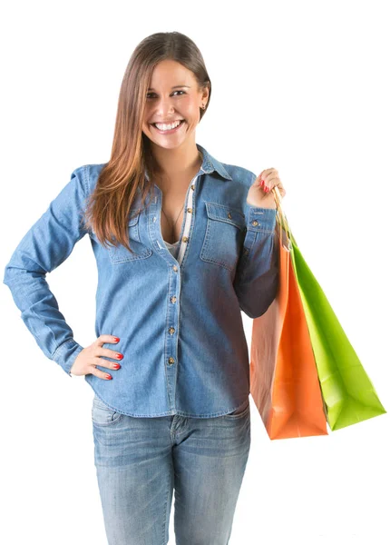 शॉपिंग बैग ले जाने वाली महिला — स्टॉक फ़ोटो, इमेज