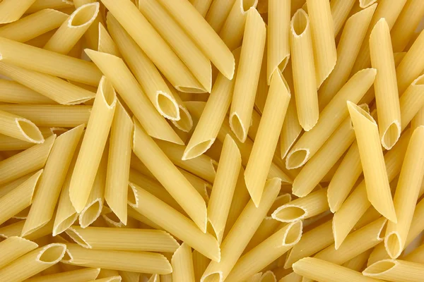 Penne tło makaronu — Zdjęcie stockowe