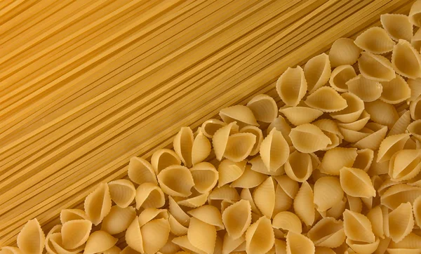 Variety of types and shapes of dry Italian pasta — Stock Photo, Image