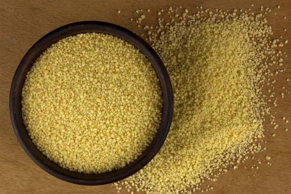 Couscous into a bowl on the table — Stock Photo, Image