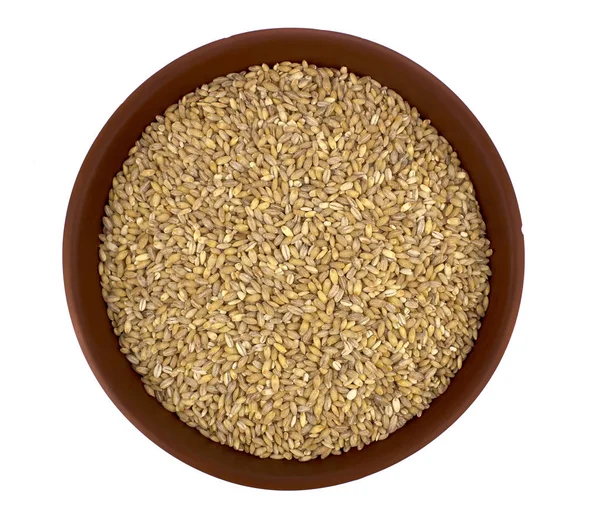 Raw organic pearl barley into a bowl isolated on the white backg — Stock Photo, Image