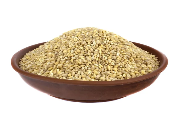 Raw organic pearl barley into a bowl isolated on the white background — Stock Photo, Image