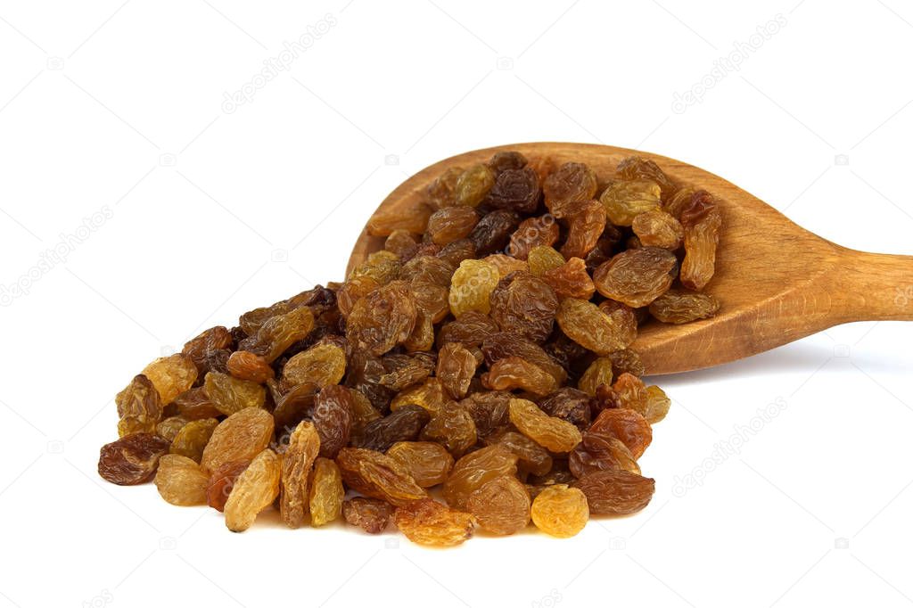 Raisin on wooden spoon isolated over white background