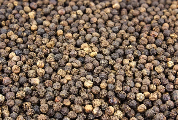 Fundo de sementes de pimenta preta. Macro shot — Fotografia de Stock