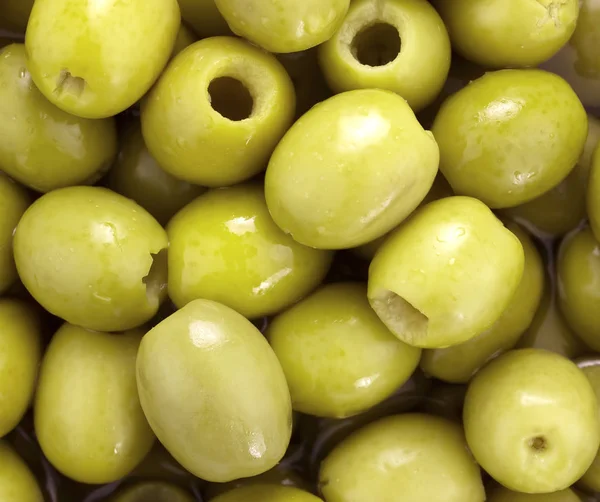 Muitas azeitonas verdes como fundo — Fotografia de Stock