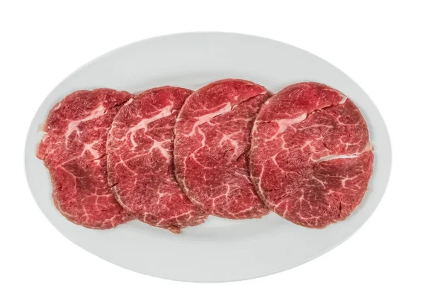 Raw beef fillets on a plate — Stock Photo, Image