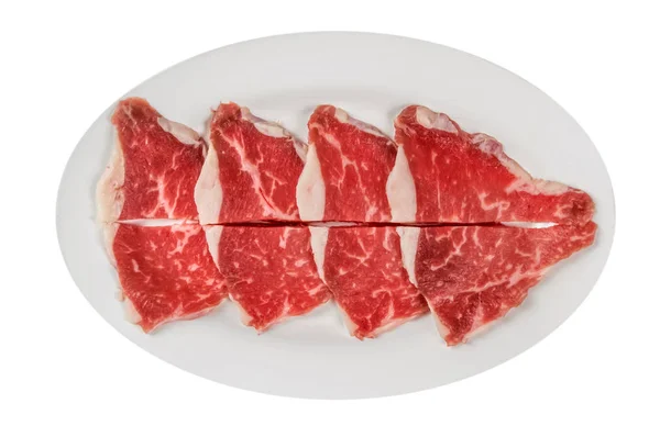 Filety z surowej wołowiny na talerzu — Zdjęcie stockowe