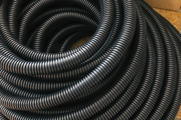 Black ribbed plastic hose — Stock Photo, Image