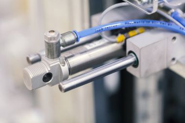 pneumatic piston unit on industrial machine clipart
