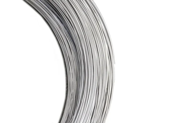 Silver wire coil on white — Stock Photo, Image