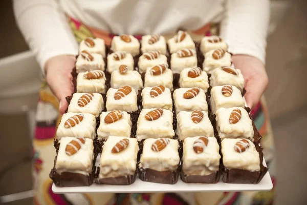 Small cake with almonds on a tray — Stock Photo, Image