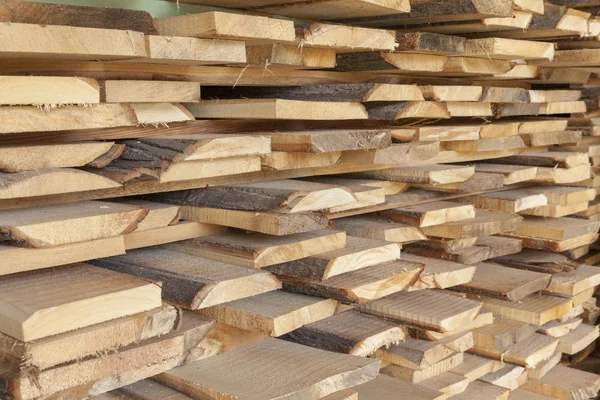 Wooden beams stacked in a pile — Stock Photo, Image