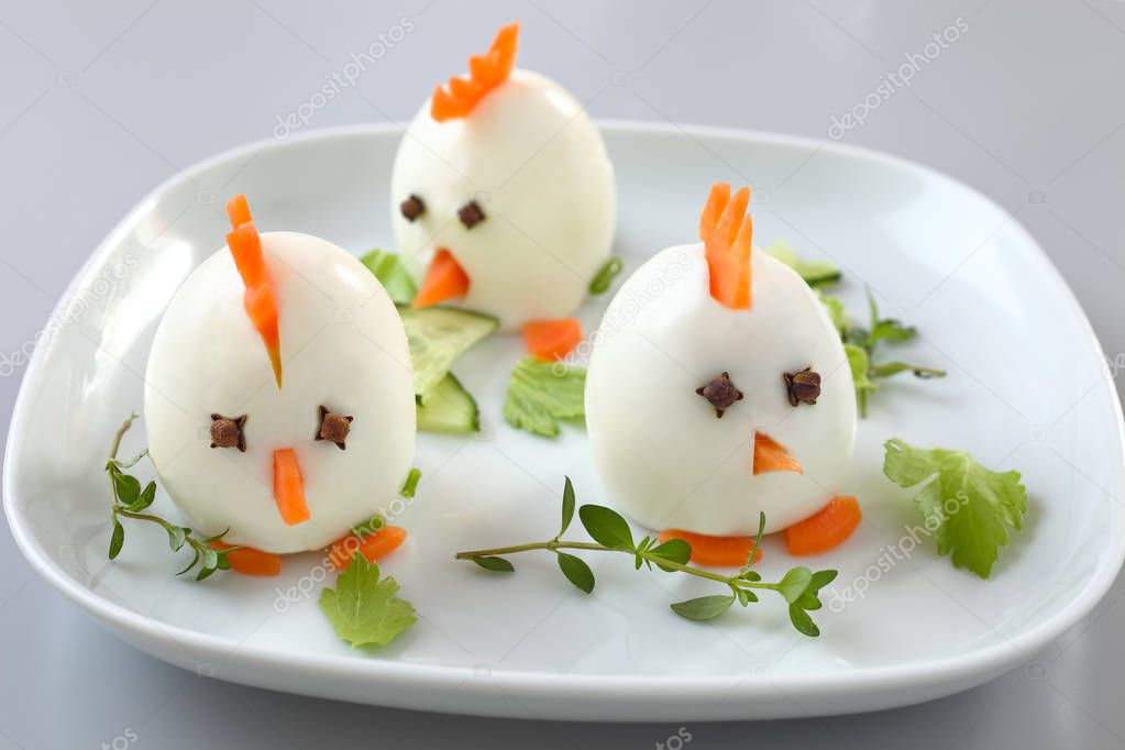 Funny chickens made from hard boiled eggs.